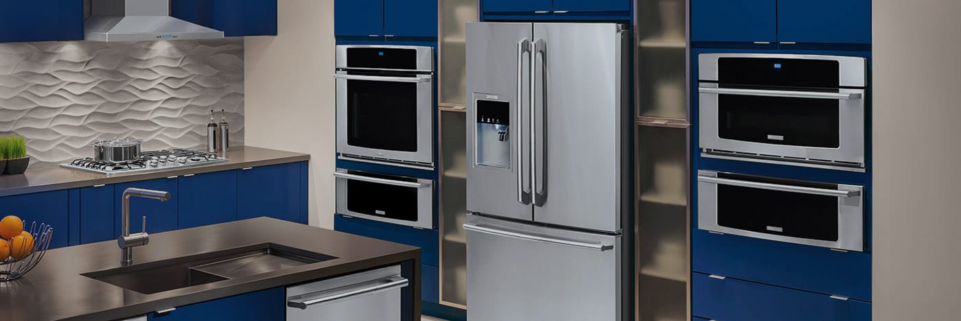 Blue and gray kitchen highlighting matching kitchen appliances