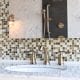 Beautiful bathroom sink faucet from Facets of Lafayette's showroom. Tile backsplash in background