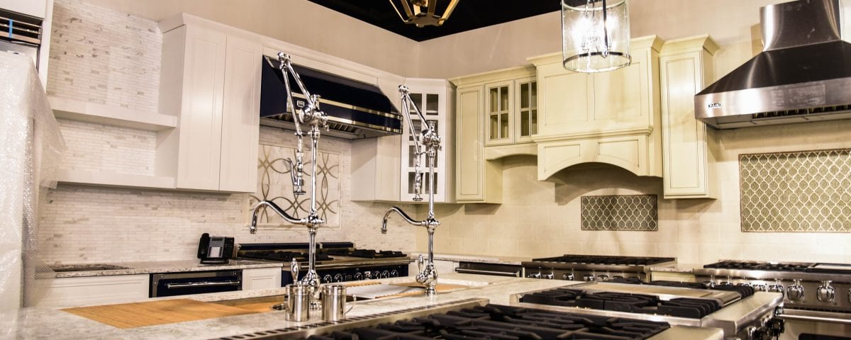 Beautiful kitchen with farmhouse lighting and Facets of Lafayette Kitchen Appliances