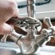 Fixing a sink faucet with pliers